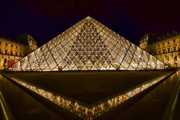 Pyramide du Louvre. Photo taken at 11:14 p.m. - July 23, 2015. I used a 240 second (4 min.) exposure to capture as much light as possible and to "ghost out" any people walking through the scene.