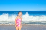 Eva plays in the waves at Black Brook Beach, Cabot Trail, Cape Breton, Nova Scotia